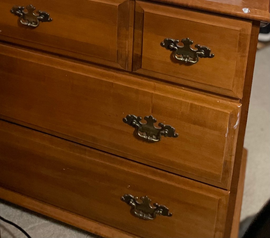 old dresser ready to be refinished close up photo 